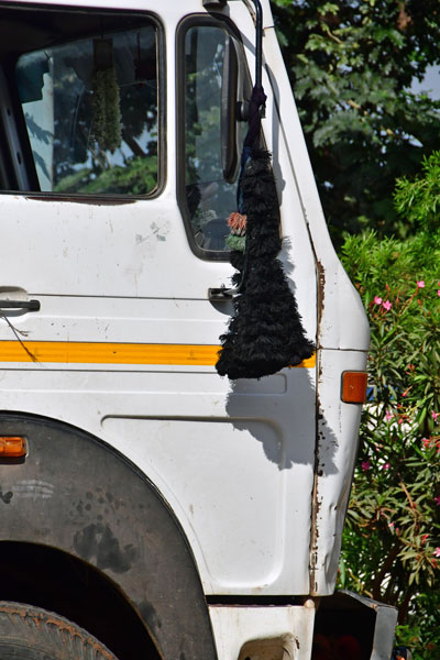 Black tassels warding off evil on the road - India-2-0351