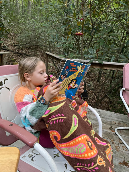 09-09 Ms B reading at the cabin 3151
