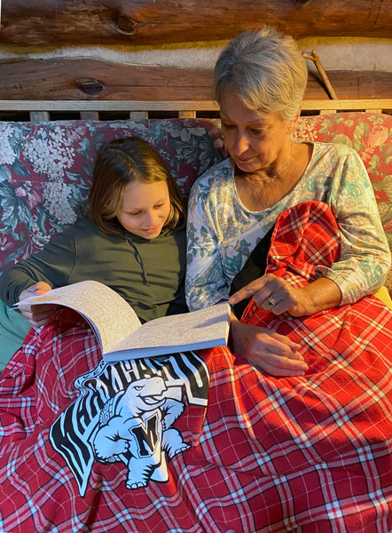 09-10 Ms. O and Grammy snuggled under a blanket in the cabin i3186