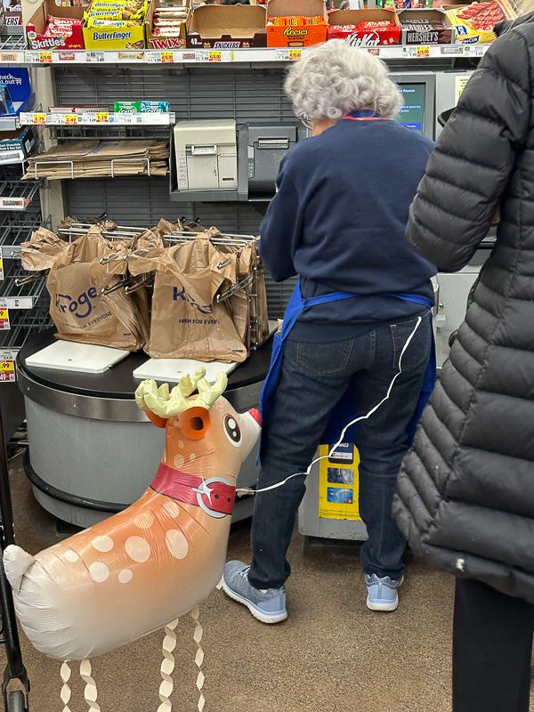 2024 12 24 Grocery store clerk and Rudolf i2290