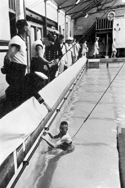 UNDATED - LESSON IN OLD SWIMMING POOL, NOTE LINE AROUND WAIST.jpg