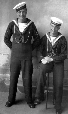 1932 - DICKIE DOYLE, PO BOY AND BOY, BOTH WITH CALL CHAINS AND THE BOY LOOKS TO HAVE A MARKSMANS BADGE..jpg