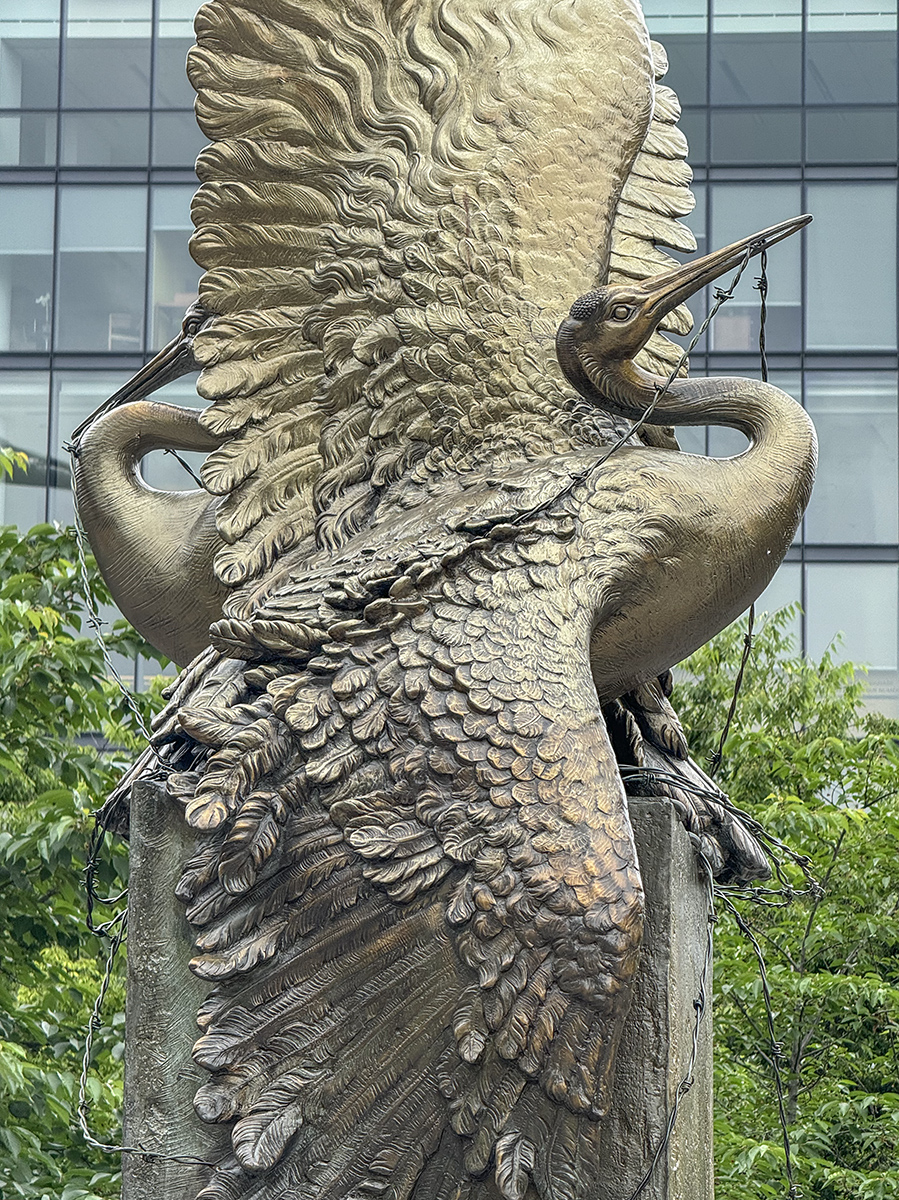 Cranes entangled in barbed wire: Japanese American Memorial