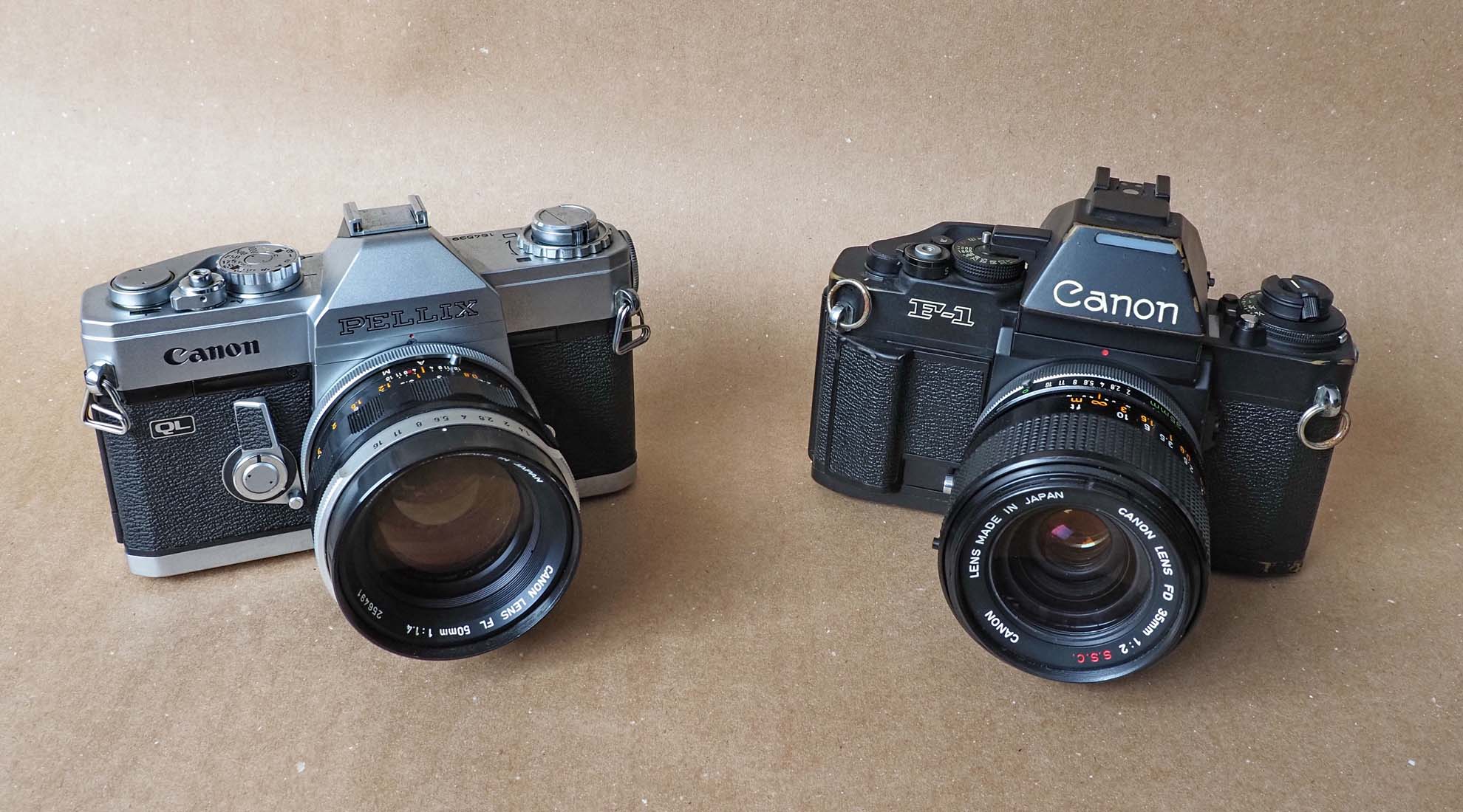 Canon Pellix (1965, with a FL lens) and Canon F1n (1981). 
