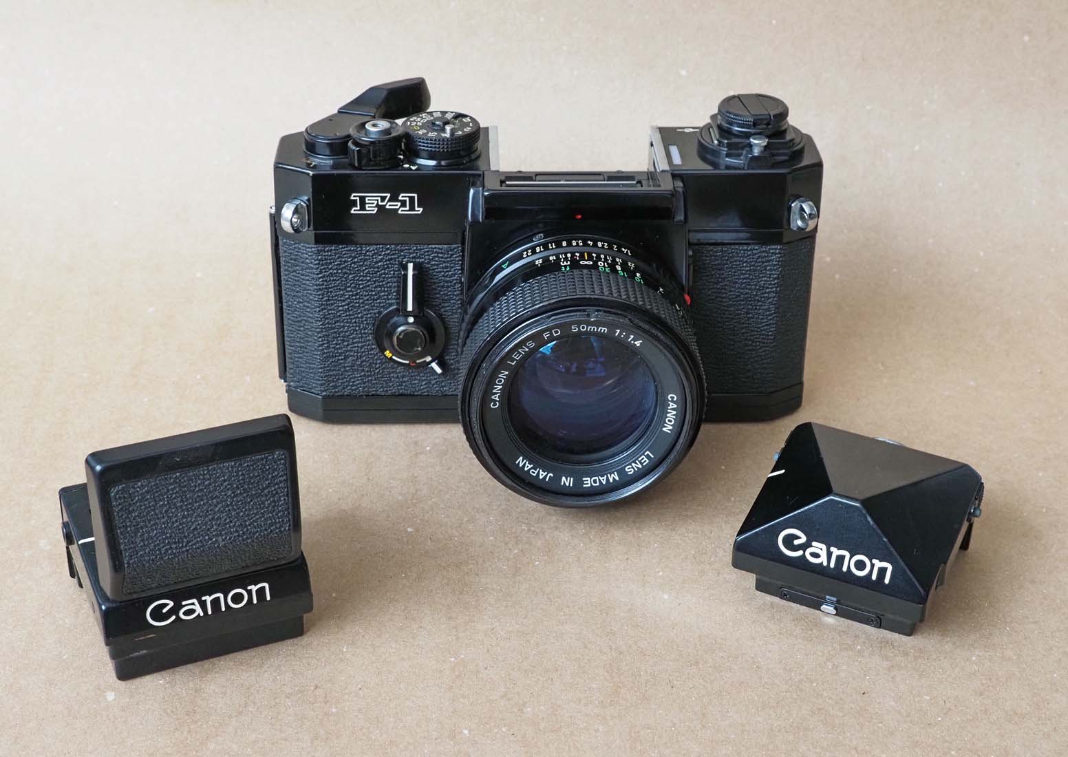 Canon F1; it has interchangeable screens and viewfinders; a large number of accessories was available for this camera. 