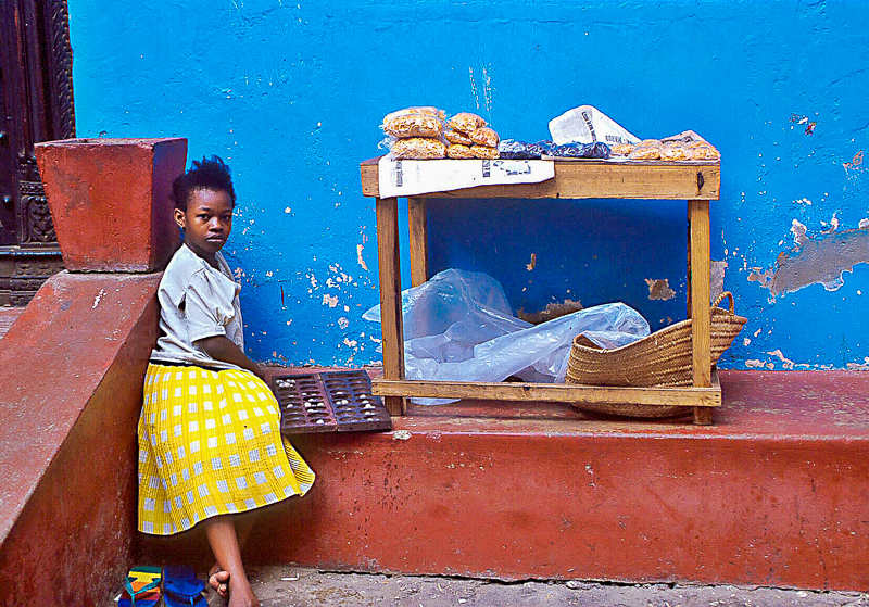 Child waiting at a bakery in Stone Town, Zanzibar