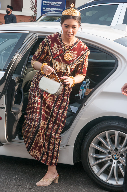 A VIP in traditional dress arrives for the Sultan's 77th Birthday festivities, Brunei