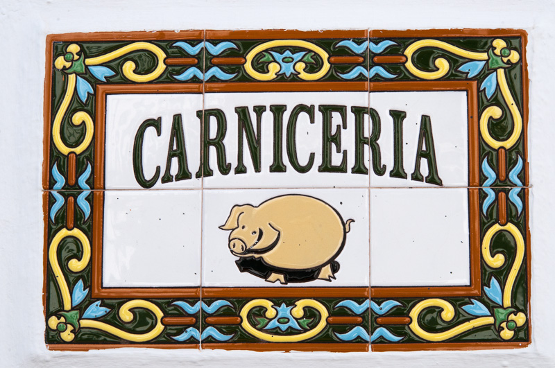 Pork butcher's sign created with glazed tiles