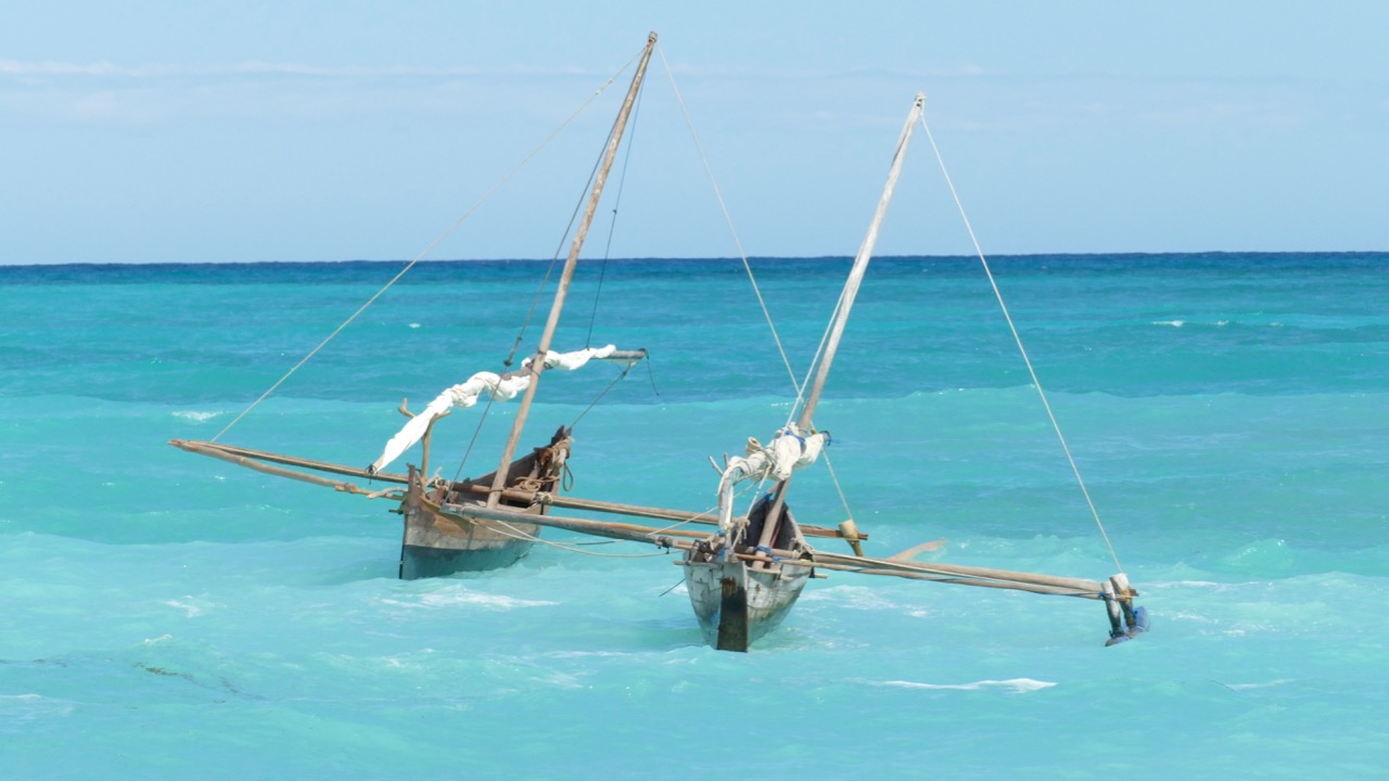 Small boat moored off Nosy Iranja beach