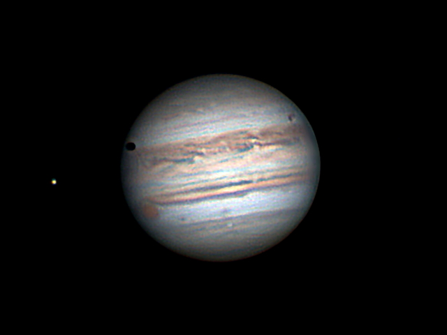 Jupiter, Ganymede and shadow and Io
