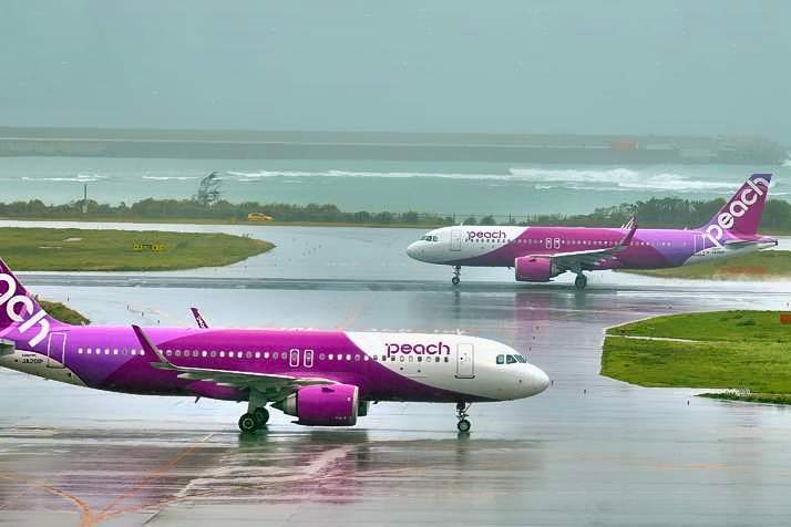 Peach Airbus A320 NEO, JA201P, And JA210P