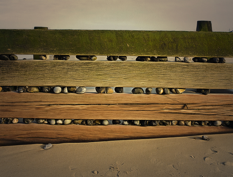 Photo of Stones caughtup in breakwater, Walcott, Norfolk,UK