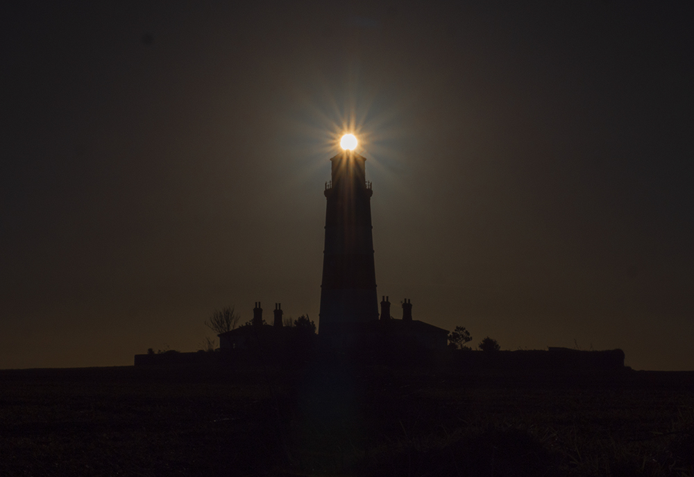 asunbehind lighthouse.jpg