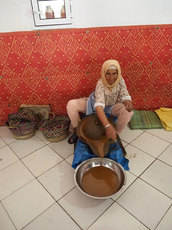 Grinding the argan seeds to extract the oil