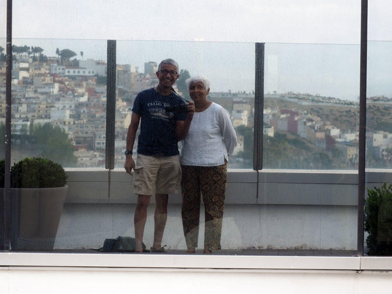 Our reflection - On a patio on the top floor of the Hilton