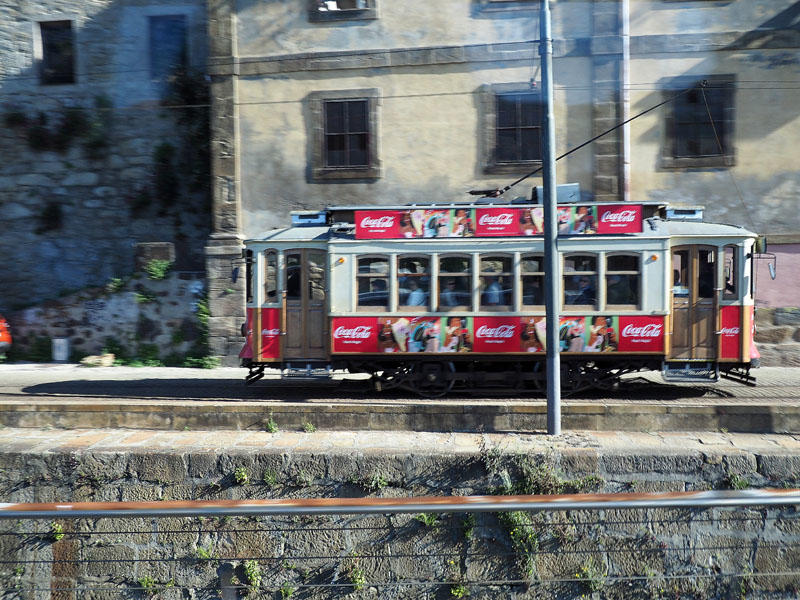 Tram running along the Douro river waterfront