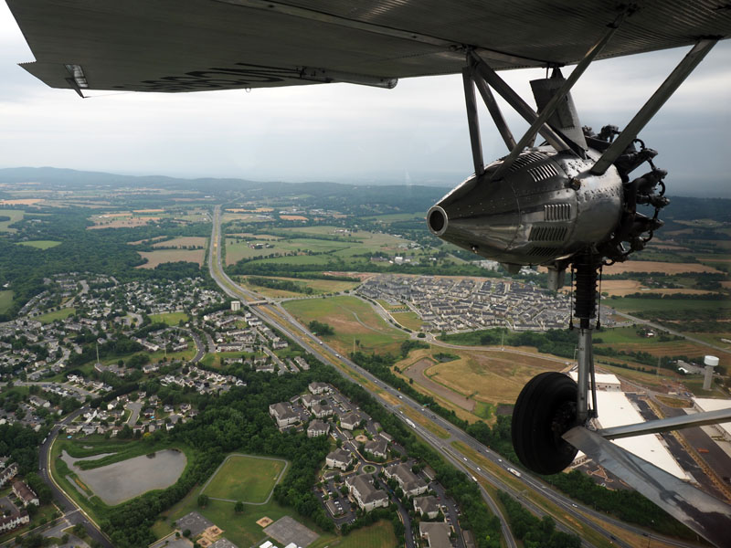 Crossing the highway in a Ford 5-AT-B Tri-motor