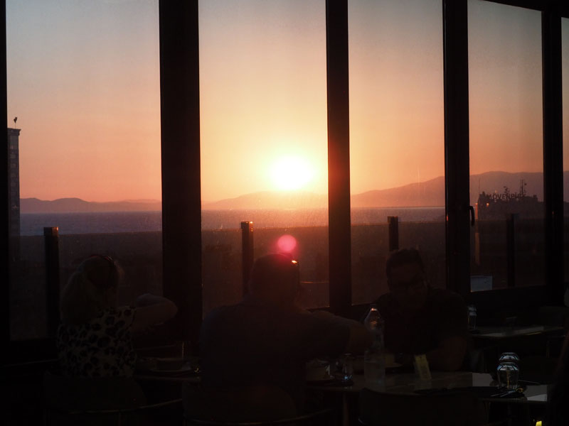 Sunset through the glass panes of the restaurant
