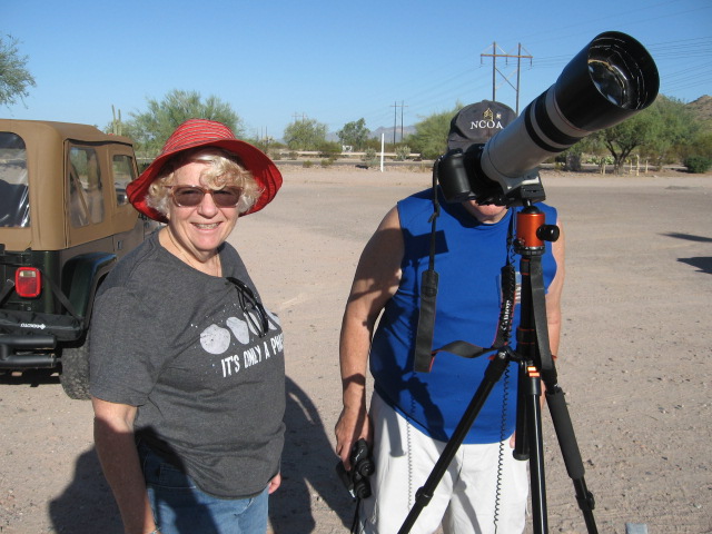 Kathleen Audette (l) along with Art Fesler-Butts (behind the telescope)