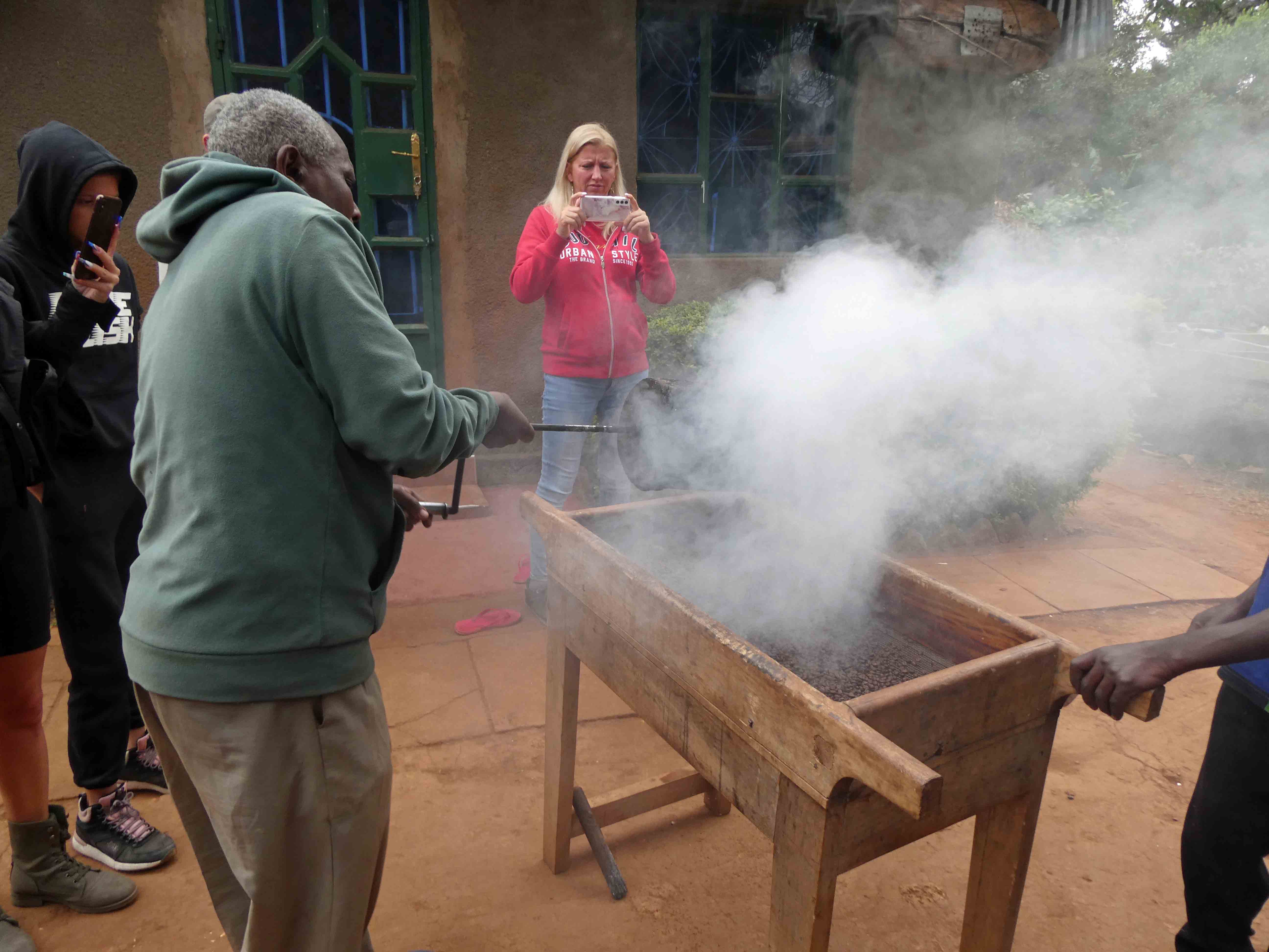 Dumping roasted beans into cooling bin
