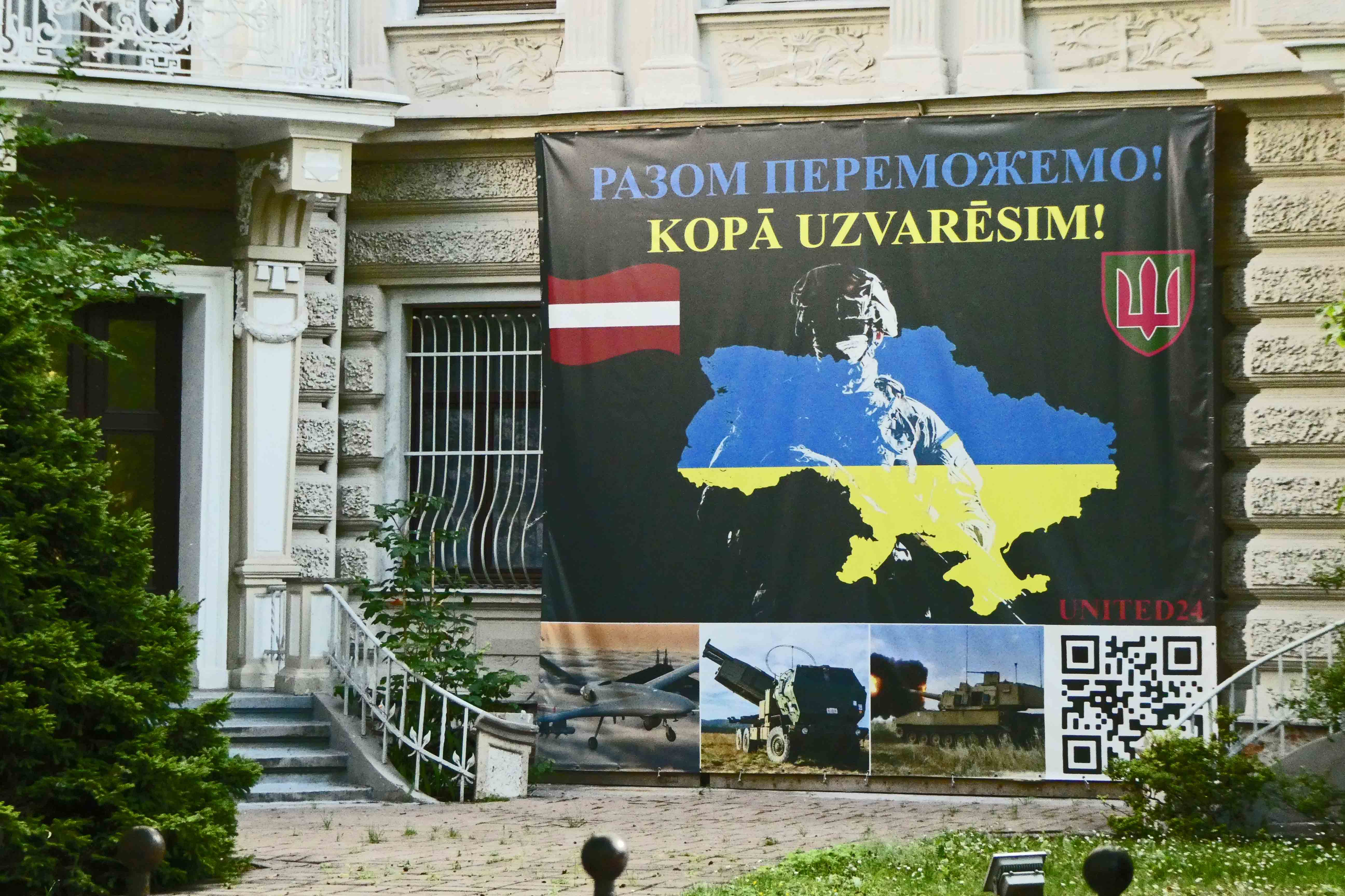 Banner in front of Ukranian Embassy says, We will win together