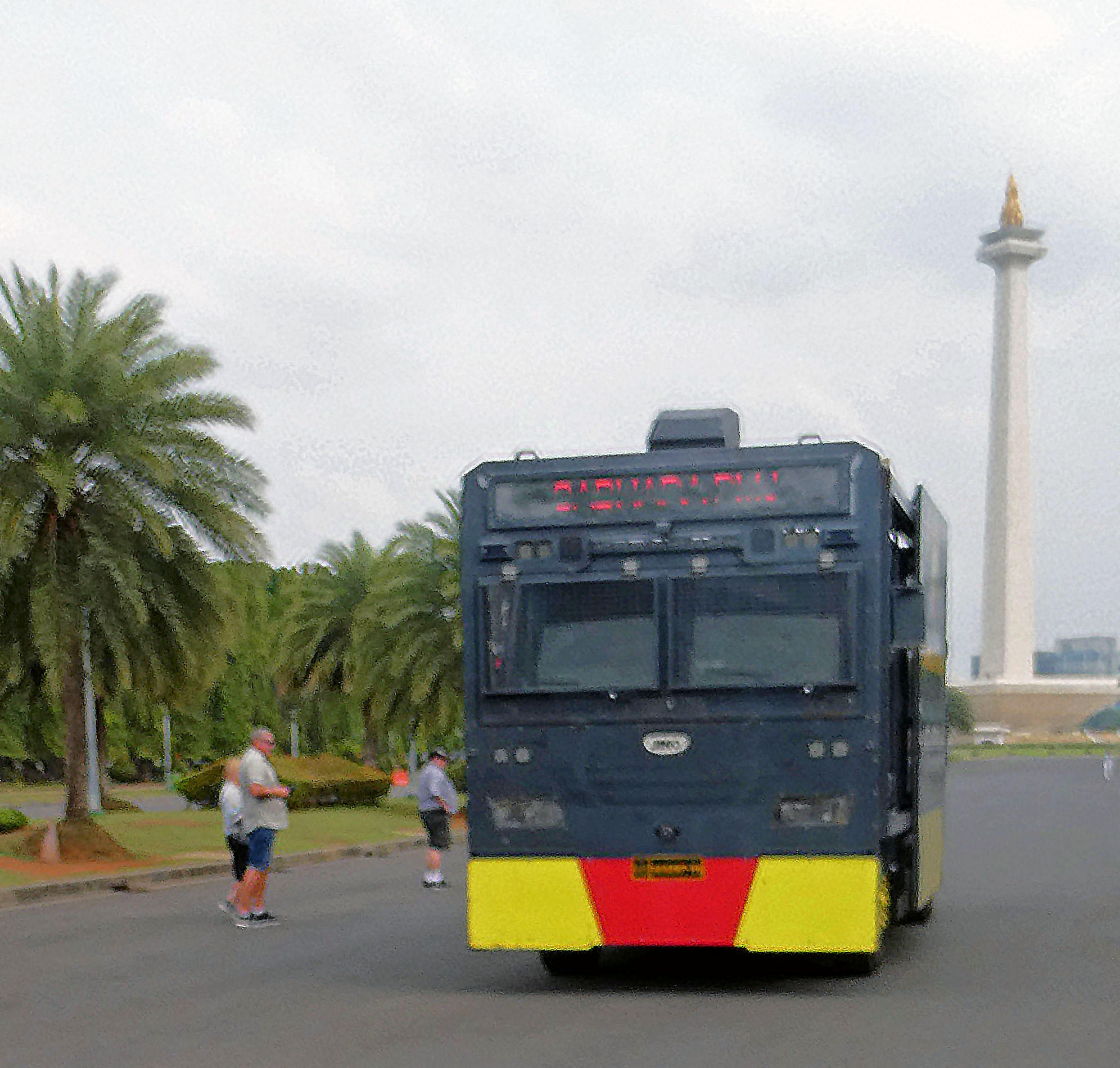 Moving out of the way of a SWAT vehicle in Jakarta, Indonesia