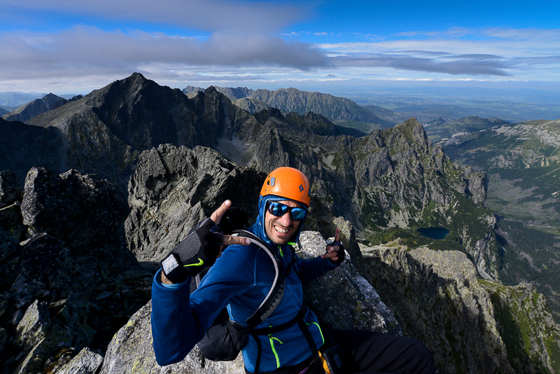 Szymon on the summit of Ganek, behind on the left Rysy