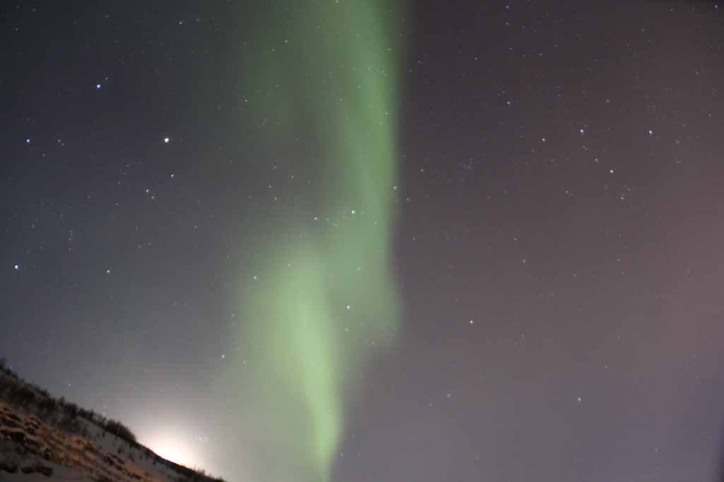 AURORA BOREALIS FROM MT PAESKATUN WITH MOON SETTING ALONG THE CREST