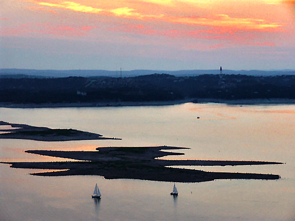 Two sailboats after sunset, Lake Travis TX