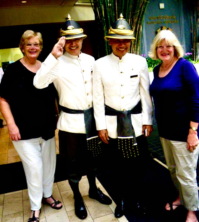 Happy visitors with the doormen at The Peninsula Hotel