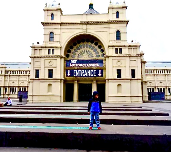 The Melbourne Exhibition Building and a small boy