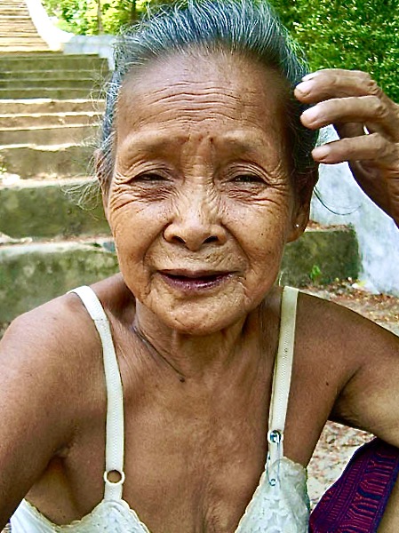 Woman in a village across the Mekong