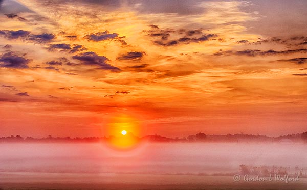 Sun Rising Beyond Ground Fog 90D04212-6