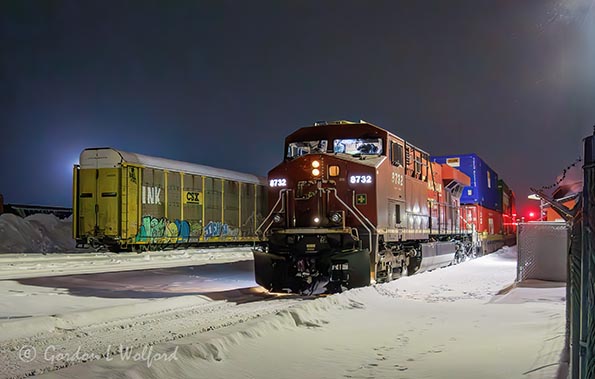 CPKC Westbound Freight Train At Night 90D143193