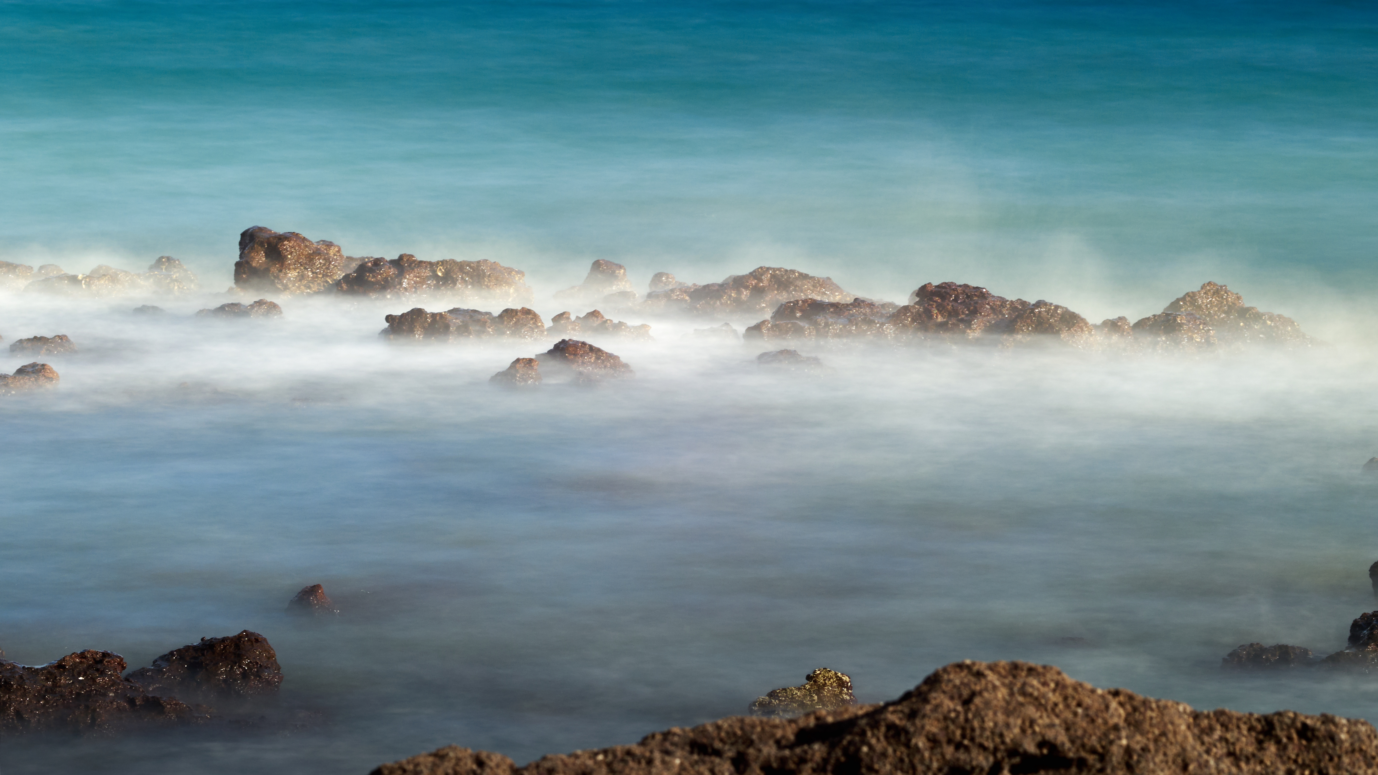 Sea mist over rocks