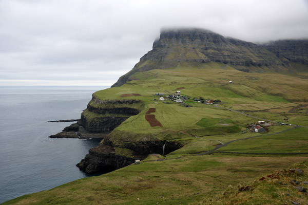 Gásadalur at the west end of Vágar, reachable by road through a tunnel since 2006