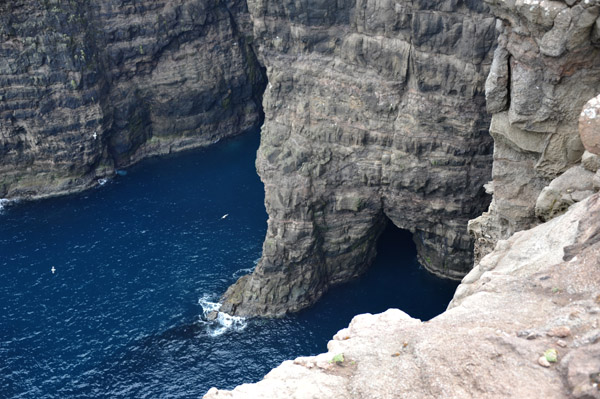 Blue ocean at the base of the cliffs, Trælanípan, Vágar, Faroe Islands