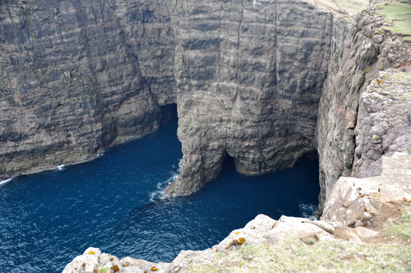Blue ocean at the base of the cliffs, Trælanípan, Vágar, Faroe Islands