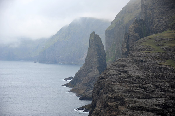 Shark-tooth shaped rock separated from the island of Vágar, Faroe Islands