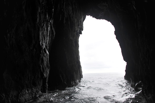 The Sjferir boat tour entering one of the large sea caves on the west coast of Streymoy