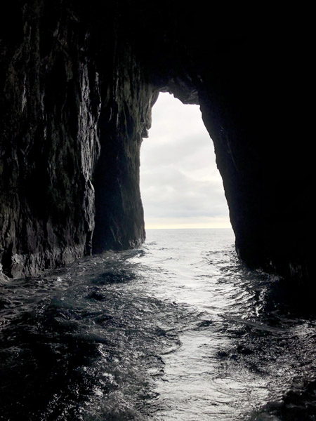 Sjferir boat tour in a sea cave, Streymoy