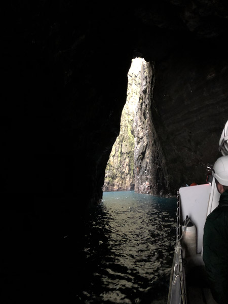 Sjferir boat tour in a sea cave, Streymoy