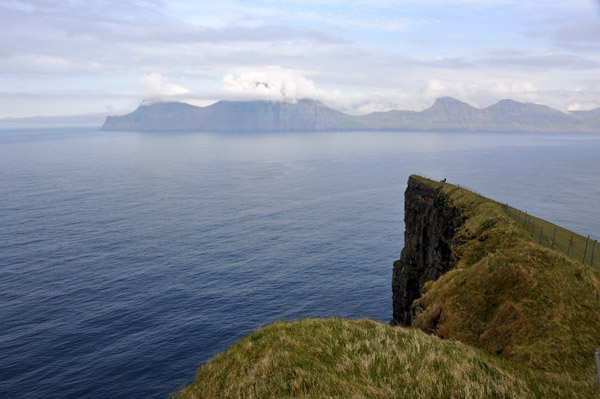 Cliffs of Gjgv with the neighbor island of Kalsoy, Faroe Islands