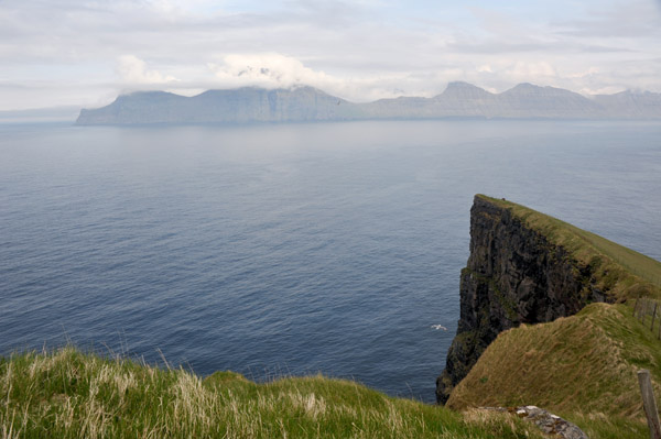 Cliffs of Gjgv with the neighbor island of Kalsoy, Faroe Islands