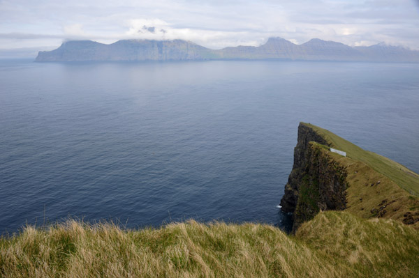 Cliffs of Gjgv with the neighbor island of Kalsoy, Faroe Islands