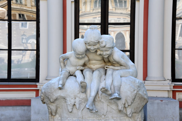 Sculpture of three children in front of the former 1842 English Club