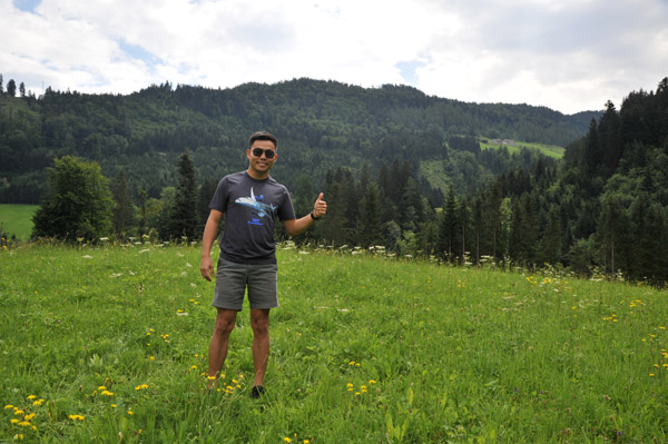 Max in a green field of the Austrian foothills of the Alps