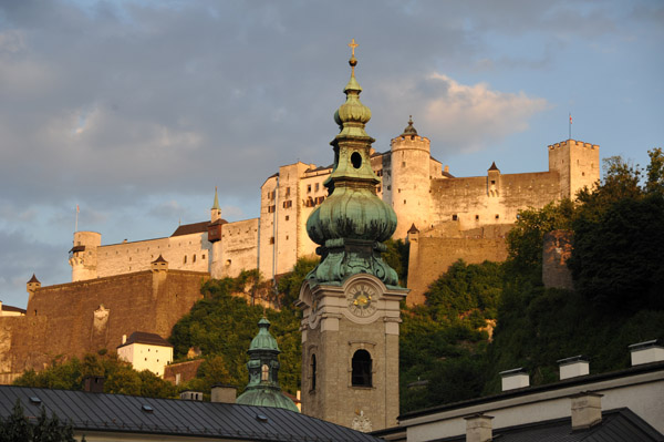 Evening in Salzburg - spire of St. Peter's with Salzburg Castle
