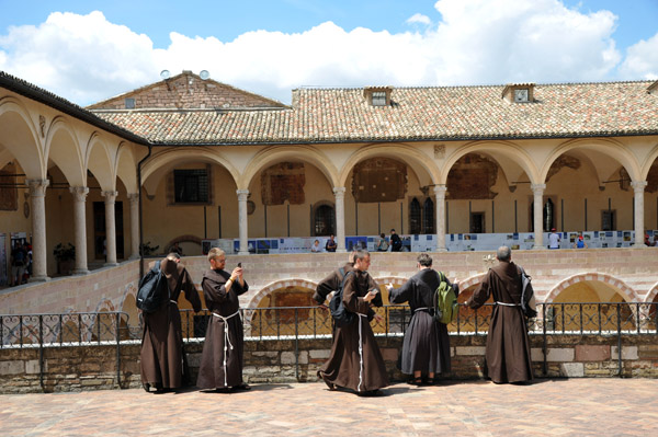 Franciscan monks touring the Basilica of St. Francis of Assisi
