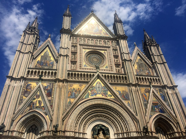 The Tuscan Gothic façade of Orvieto Cathedral in the style of Siena's cathedral